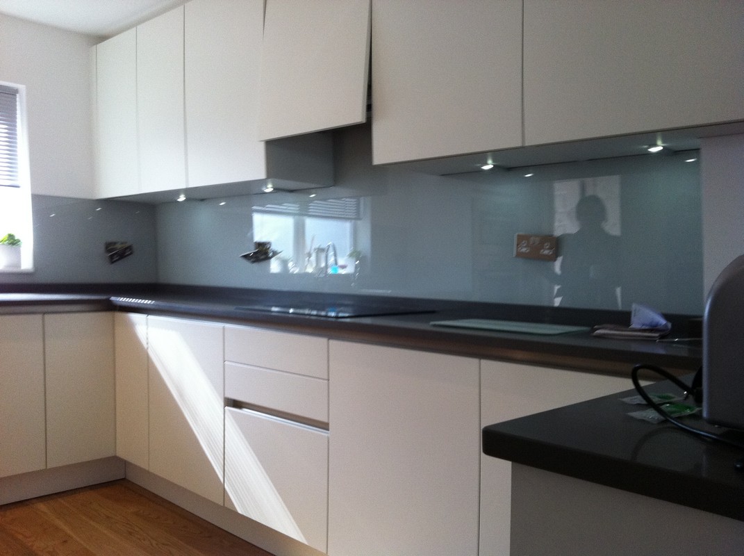 Grey glass kitchen splashback with LED lighting in Twickenham