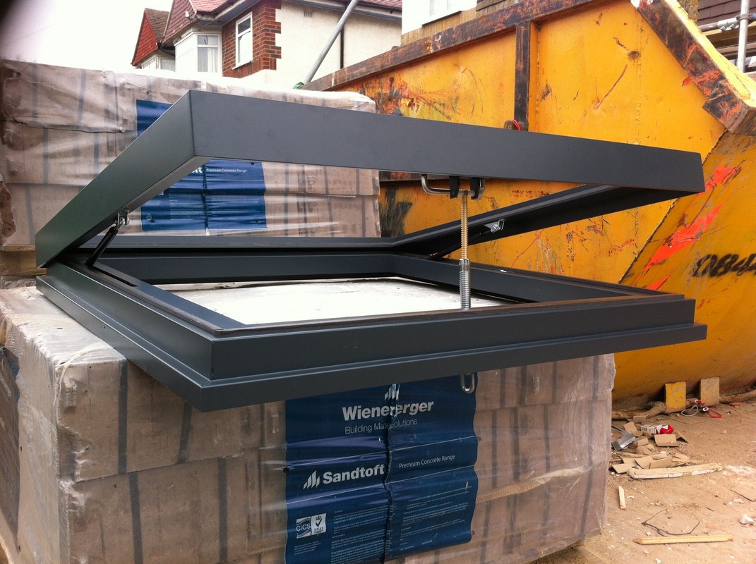 Opening flat roof skylight in anthracite grey installed in Twickenham