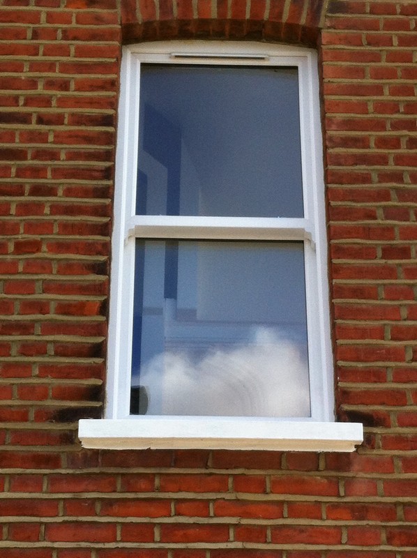 uPVC sash window on Victorian red brick house in Twickenham